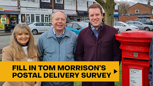 Tom Morrison with local councillors stood next to post box