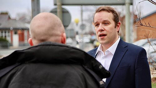 Tom Morrison MP talking to a police officer