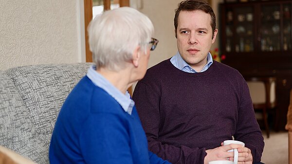 Tom chatting with Elderly Resident